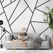 budget-friendly geometric accent wall black line design modern living room grey sofa DIY