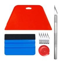 Peel and stick wallpaper application tool kit with red and blue squeegees and precision craft knife