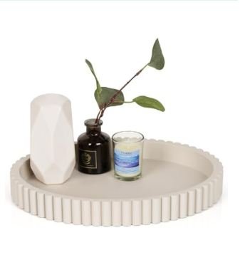 White ribbed ceramic decorative tray with fluted edges styled with white vase, plant cutting in dark bottle, and iridescent candle for modern home decor