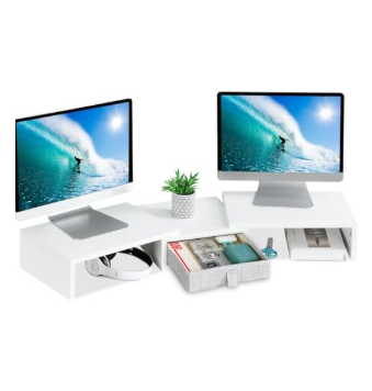 White monitor stand riser with built-in storage drawers and compartments supporting dual computer screens with small plant on clean organized desk